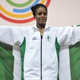 Nigeria's gold medalist Chika Amalaha celebrates on the podium at the medal ceremony for the women's weightlifting 117-pound class during the 2014 Commonwealth Games in Glasgow, Scotland, July 25, 2014.
Andy Buchanan/AFP/Getty Images